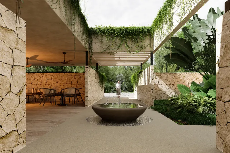 Patio del Wellness Club con fuente y muros de piedra